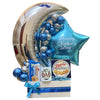 Father's Day gift basket with balloons and snacks on a wooden surface