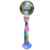 Decorative balloon with colorful tassels and 'Happy 2nd Anniversary' text against a green hedge background.