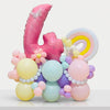 Pastel-colored balloon number '4' with flowers and a rainbow on a white background