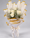 Ivory Elegance white rose and baby’s breath bouquet in white wrapping with gold edging and an ivory bow